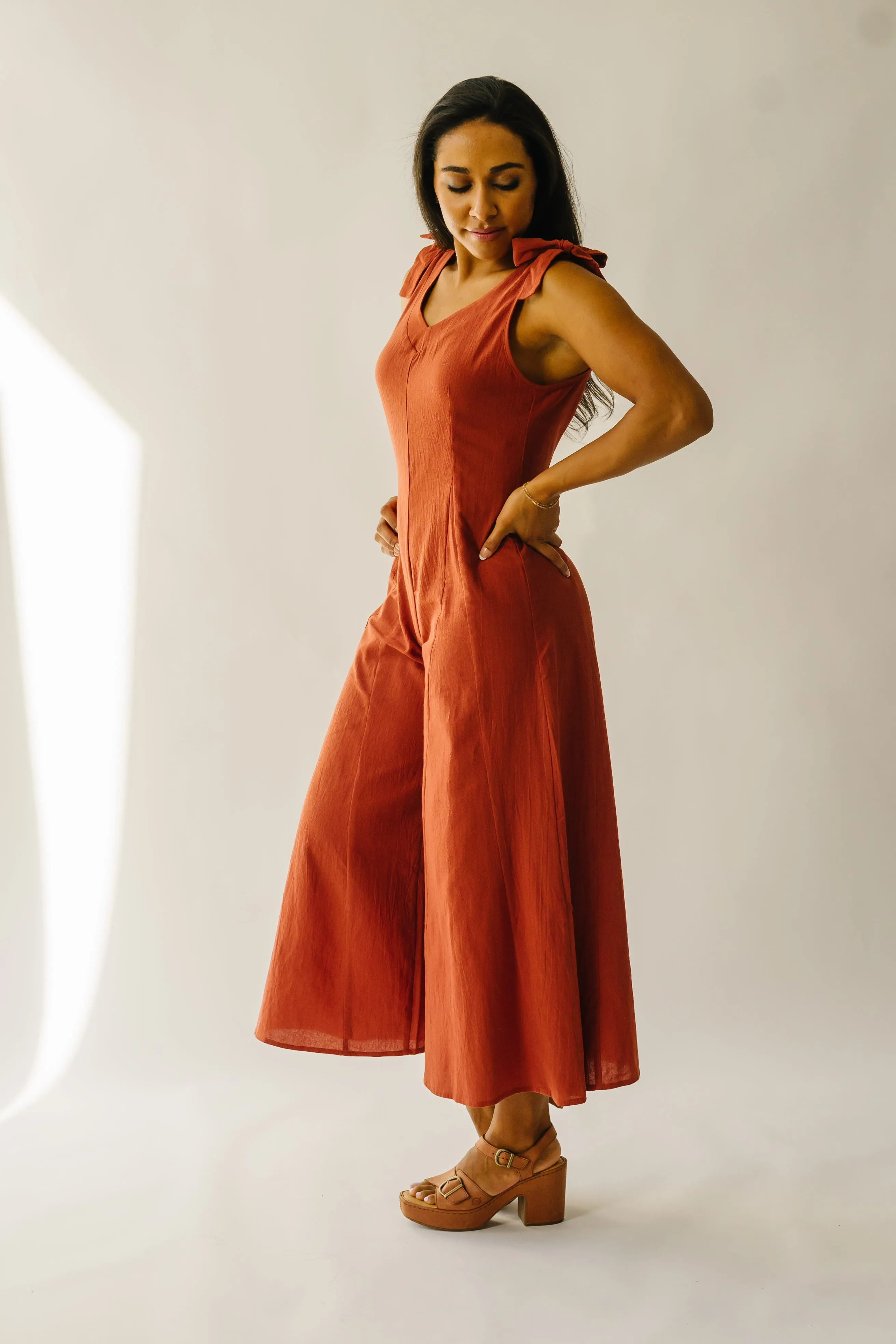 The Evannah Shoulder Tie Jumpsuit in Rust